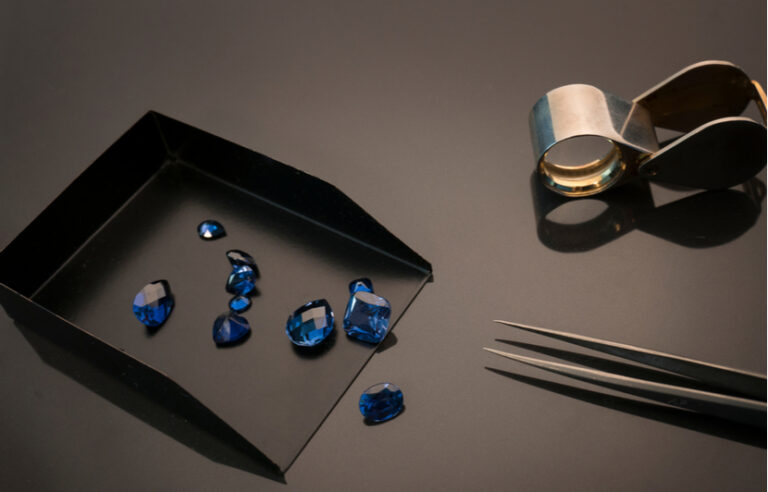 sapphire gemstones in a tray