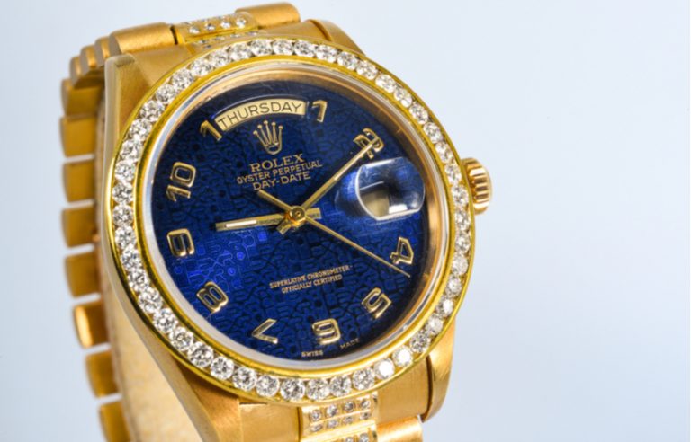 gold plated rolex with blue inside