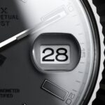 close up of rolex with cyclops lens