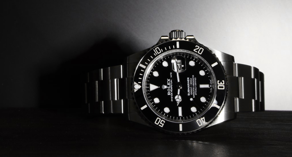 A Rolex Submariner with a black face and bezel
