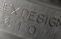 Genuine Rolex serial number with sharp diamond-cut engraving compared to a fake with rough, shallow etching.